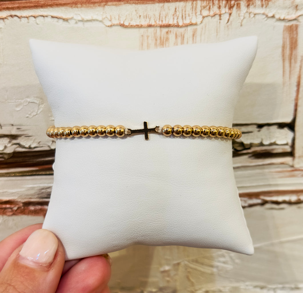 Gold cross bracelet